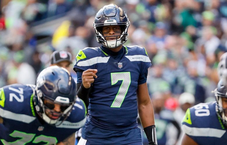 Seattle Seahawks quarterback Geno Smith points out the defense during the second quarter. 222269