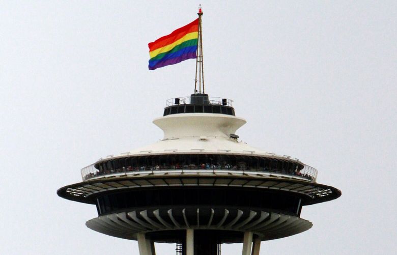 The Pride Flag is seen flying atop the Space Needle during the Seattle Pride Parade, Sun., June 28, 2015, in Seattle. This year’s parade comes days after the Supreme Court’s landmark decision to make same-sex marriage a right in all 50 states.