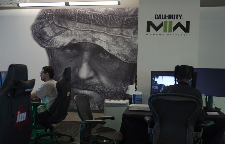 Employees test a version of Call of Duty on Oct. 21, 2022, at Activision Blizzard, Infinity Ward Division, in Woodland Hills, Calif. Call of Duty is at the heart of the developing antitrust fight over whether Microsoft will be able to acquire Activision Blizzard. (AP Photo/Allison Dinner)