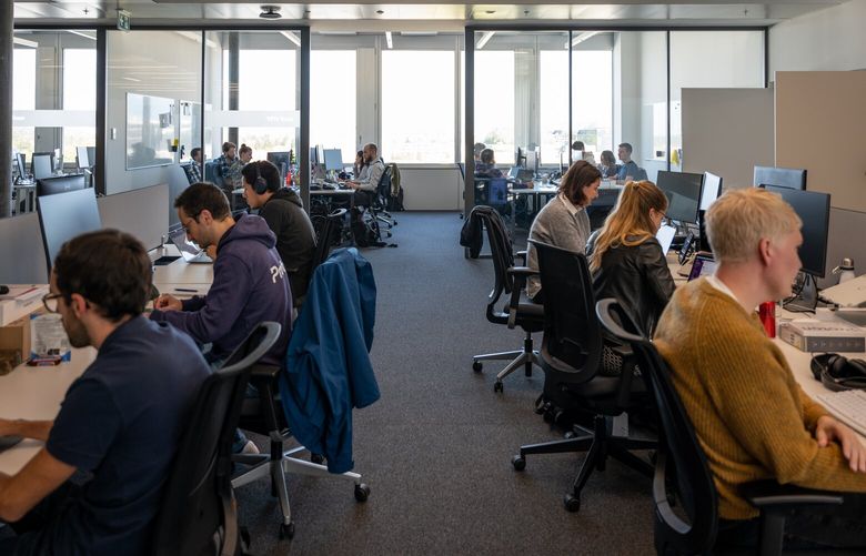 The VPN team at work at the offices of Proton in Geneva on Oct. 6, 2022. The company’s virtual private network gives users a way around government internet restrictions. (Aurelien Bergot/The New York Times)