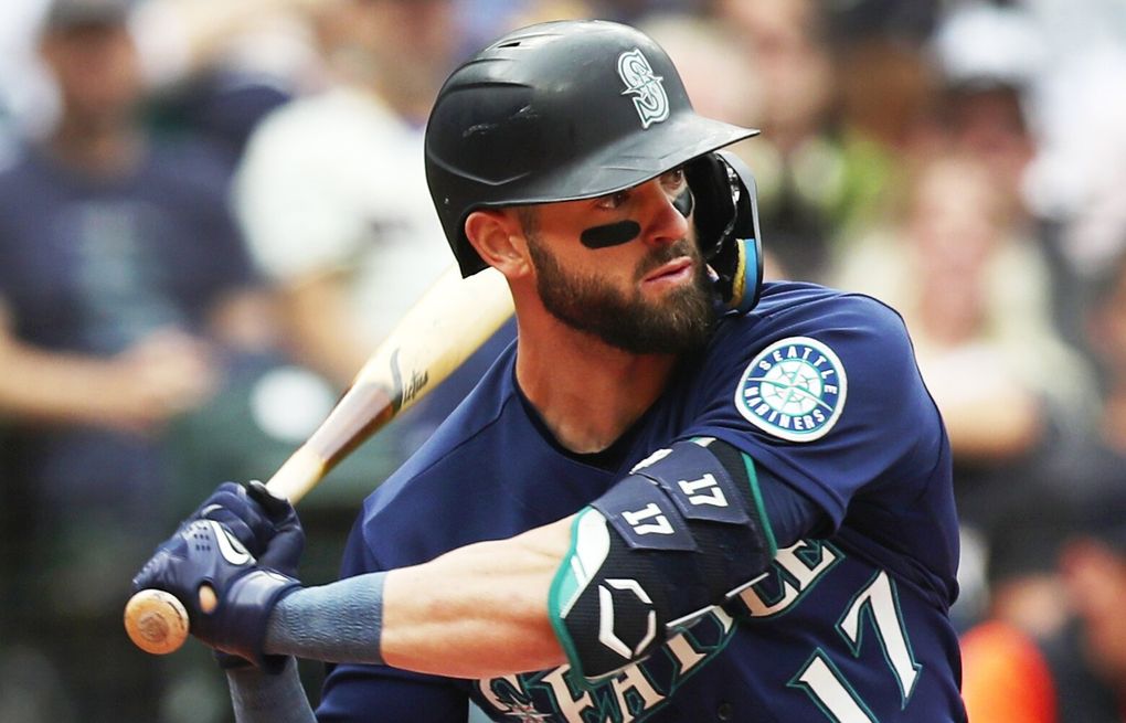 Seattle Mariners' Mitch Haniger wearing the home run helmet in the dugout  after hitting a solo home run against the Detroit Tigers during a baseball  game, Wednesday, Oct. 5, 2022, in Seattle. (