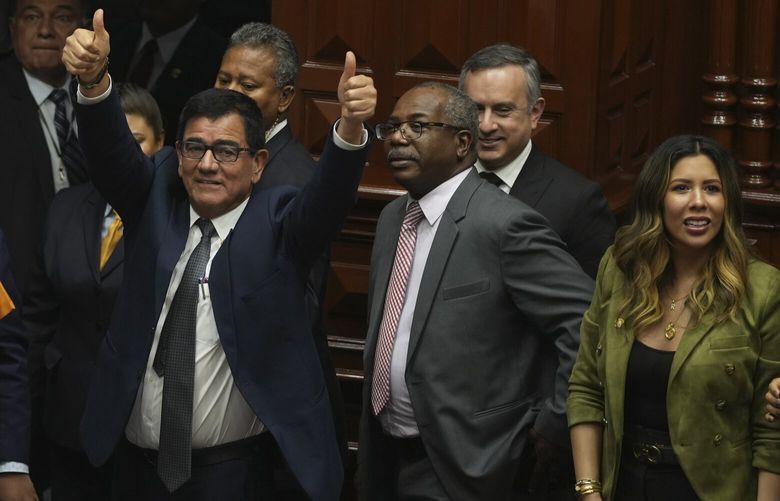 Congress President Jose Williams gives thumbs up after lawmakers verbally voted to remove President Pedro Castillo from office in Lima, Peru, Wednesday, Dec. 7, 2022. Peru’s Congress voted to remove Castillo from office Wednesday and replace him with the vice president, shortly after Castillo tried to dissolve the legislature ahead of a scheduled vote to remove him.(AP Photo/Guadalupe Pardo) XLM116 XLM116