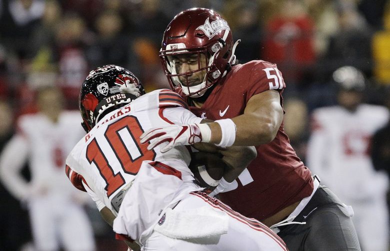 Washington State linebacker Francisco Mauigoa (51) tackles Utah wide receiver Money Parks (10) during the second half of an NCAA college football game, Thursday, Oct. 27, 2022, in Pullman, Wash. Utah won 21-17. (AP Photo/Young Kwak)