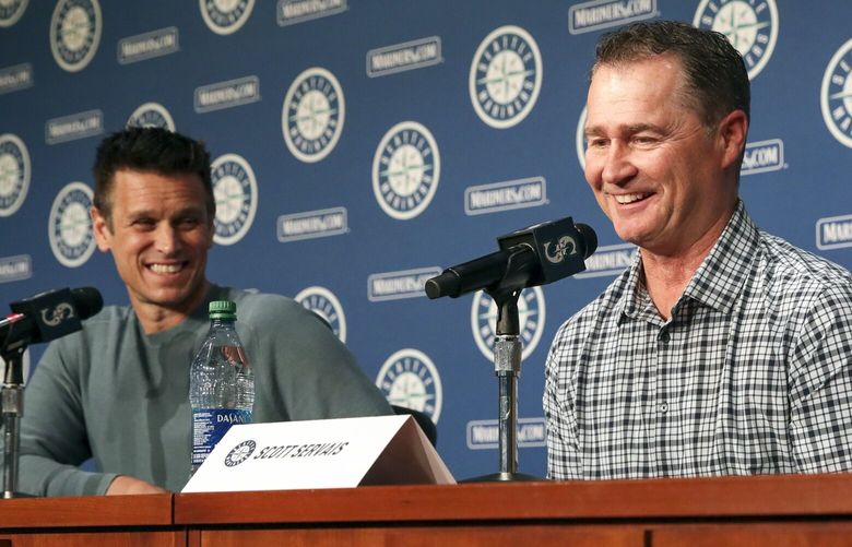 Jerry Dipoto looks on as Scott Servais fields a question during a post playoff press conference at T-Mobile Park in Seattle, Washington on October 19, 2022.