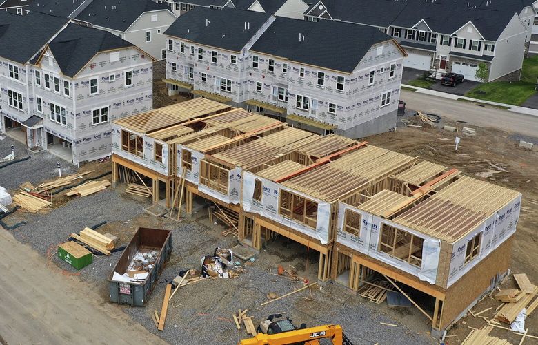 FILE – Houses under construction are seen in Mars, Pa., on May, 27, 2022. (AP Photo/Gene J. Puskar, File) 
