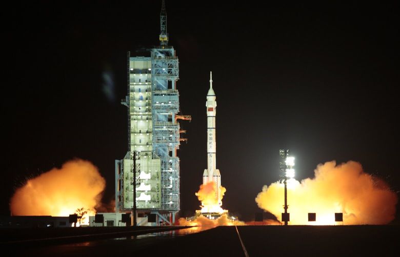 FILE – The Long March rocket, carrying the Shenzhou 15 spacecraft, lifts off from the Jiuquan Satellite Launch Center in northwestern China, Nov. 29, 2022. The Shenzhou 15 rocket launch marked the beginning of permanent occupancy by astronauts of the Chinese space station. (You Li/The New York Times) XNYT87 XNYT87
