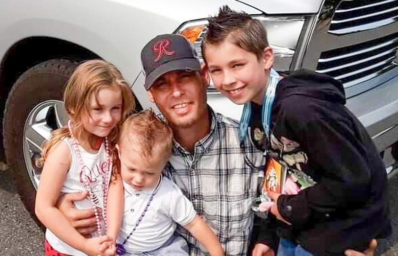 William Yurek, 45, pictured with his three young children, died from a heart attack in November. The family’s attorney says medics delayed treatment waiting for police because he was mistakenly listed as a threat to first responders.