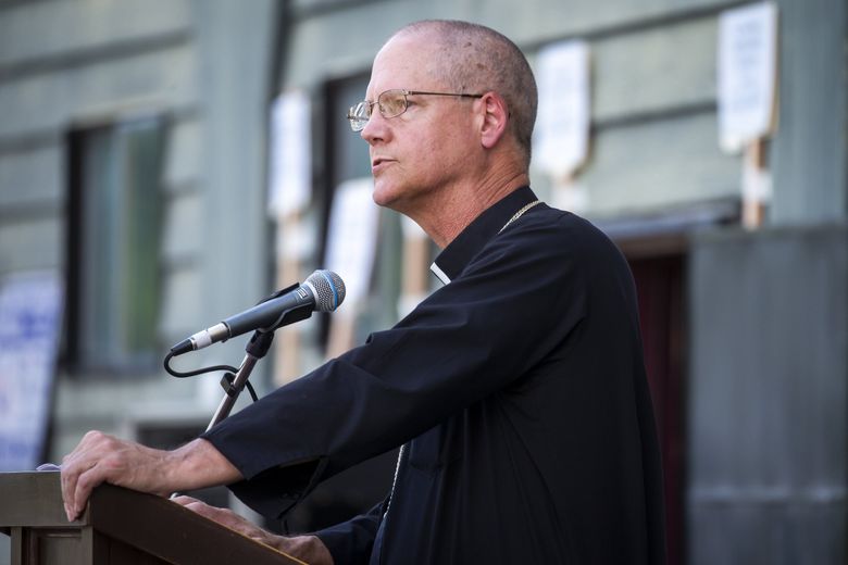 Seattle Archbishop Paul Etienne at a  prayer vigil for racial justice in July 2020. The archdiocese&#8217;s purchase of a home in Mount Baker for Etienne has raised eyebrows as parishes close.  (Bettina Hansen / The Seattle Times)