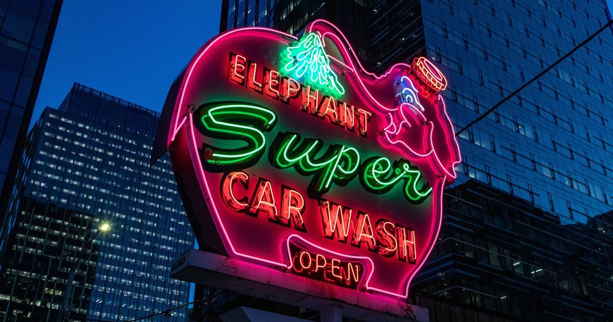 One of the famous pink Elephant Car Wash signs returns to the streets