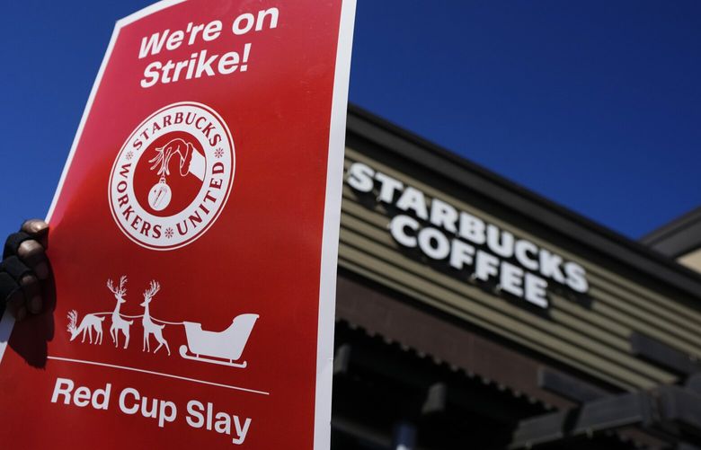 FILE – Starbucks employees strike outside their store in Mesa, Ariz., Nov. 17, 2022. Starbucks workers around the U.S. are planning a three-day strike starting Friday, Dec. 16, as part of their effort to unionize the coffee chain’s stores. (AP Photo/Matt York, File) NYSS424 NYSS424