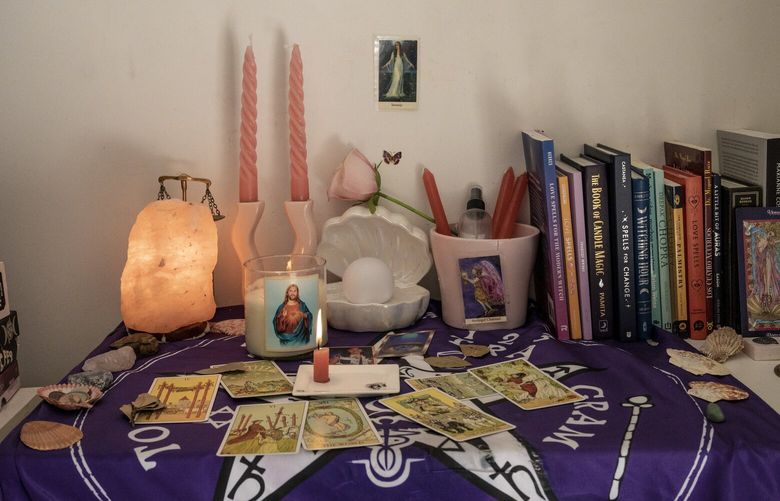 An altar in the bedroom of Violeta Parisi, one of the hundreds of witches across the country practicing magic to help their national team, in Buenos Aires on Dec. 15, 2022. The witches focused on the World Cup represent a wide variety of occult disciplines, more New Age than ancient and Indigenous. (Anita Pouchard Serra/The New York Times) XNYT134 XNYT134