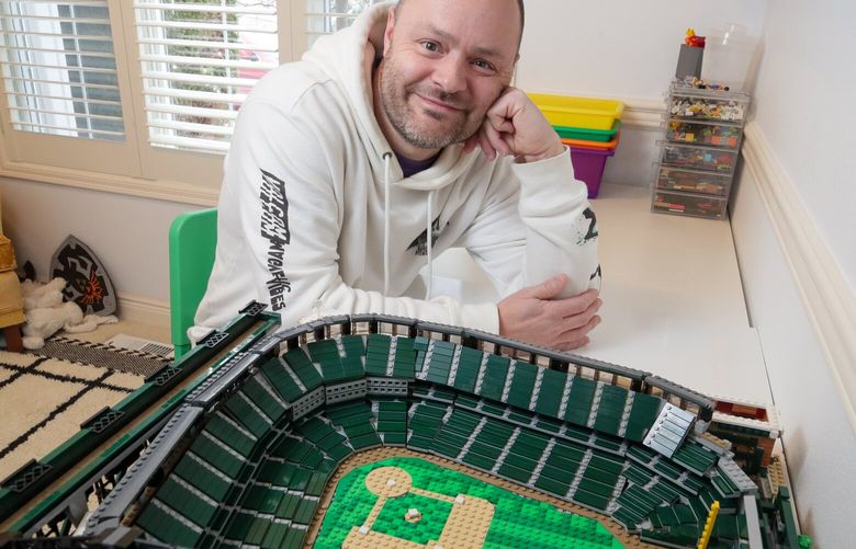 Shane Deegan built a replica of T-Mobile Park out of approximately 12,000 LEGOs and 60 hours of a labor of love. Photographed at his home in Mukilteo, Washington on December 19,2022.