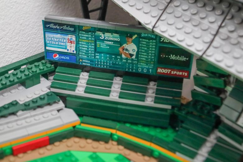 Shane Deegan’s T-Mobile Park replica, made with approximately 12,000 Legos, with a painstakingly accurate scoreboard featuring Mike Zunino. (Kevin Clark / The Seattle Times)
