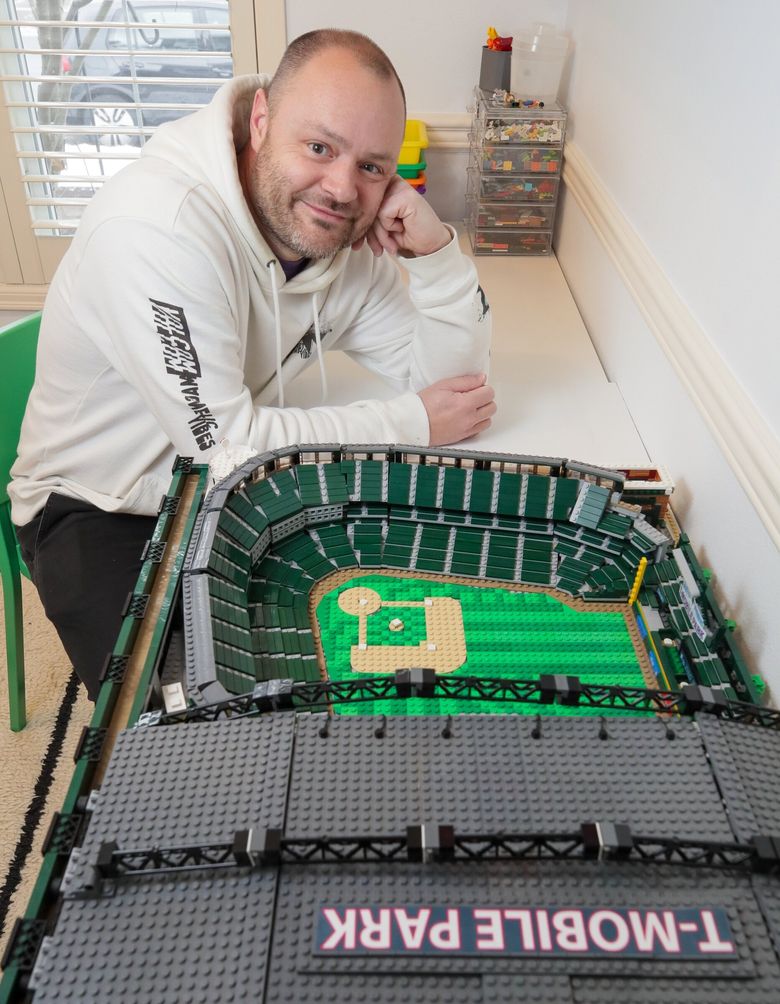 Shane Deegan, here at his Mukilteo home, built a replica of T-Mobile Park out of approximately 12,000 Legos in a 60-hour labor of love. (Kevin Clark / The Seattle Times)