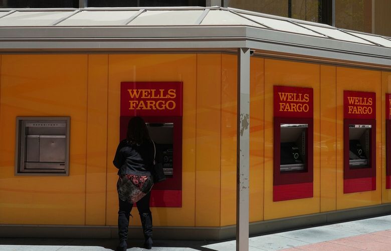 Outside Wells Fargo’s corporate headquarters in San Francisco, May 9, 2022. Wells Fargo has agreed to pay $1.7 billion in fines and $2 billion in redress to settle claims that it engaged in widespread banking violations over the last decade that harmed millions of consumers, the Consumer Financial Protection Bureau said on Tuesday, Dec. 20. (Jim Wilson/The New York Times)