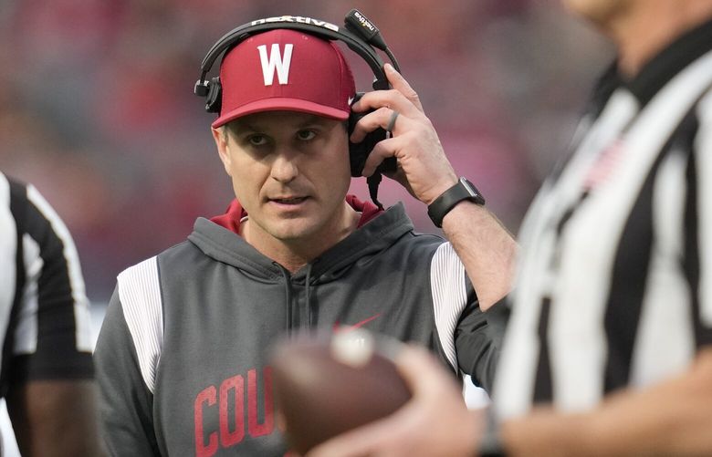 Washington State head coach Jake Dickert talks to officials during the first half of the LA Bowl against Fresno State in Inglewood, Calif., Saturday, Dec. 17, 2022. (AP Photo/Ashley Landis) otk103 otk103