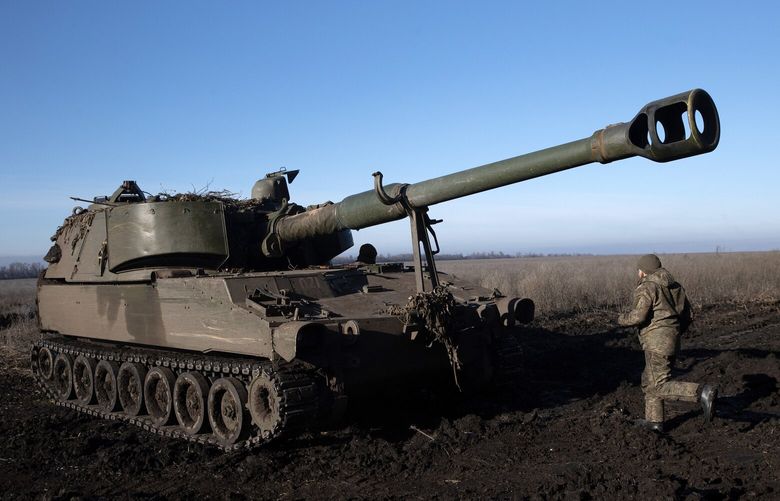 Ukrainian soldiers run to their Krab self-propelled howitzer as they come under artillery bombardment from Russian forces responding to their volley in the Donetsk region of Ukraine on Tuesday, Dec. 20, 2022. (Tyler Hicks/The New York Times) XNYT165 XNYT165