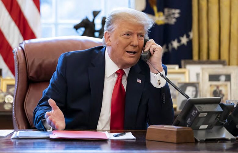 In this image released in the final report by the House select committee investigating the Jan. 6 attack on the U.S. Capitol, on Thursday, Dec. 22, 2022, President Donald Trump talks on the phone to Vice President Mike Pence from the Oval Office of the White House on the morning of Jan. 6, 2021. (House Select Committee via AP) DCJE707 DCJE707