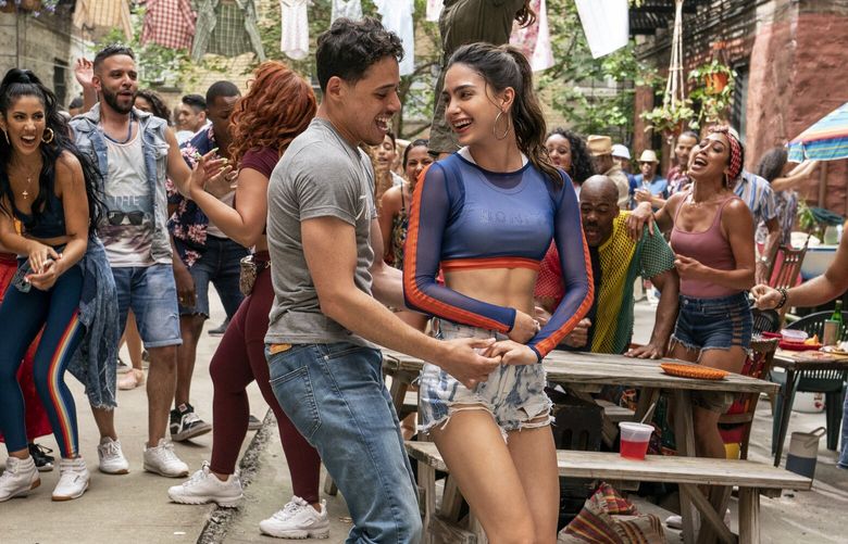 Anthony Ramos as Usnavi and Melissa Barrera as Vanessa in Warner Bros. Pictures “In the Heights”