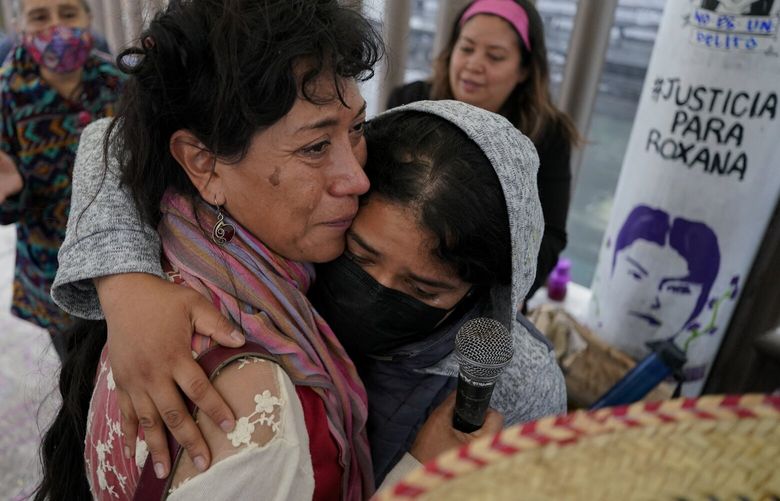 Roxana Ruiz, right, is hugged by Araceli Osorio Martinez, the mother of murdered Lesvy Berlin Osorio, outside a court on the day of Roxana’s hearing where she is accused of killing a man in 2021 who she says raped her and threatened her life, in Chimalhuacán, State of Mexico, Mexico, Monday, Abril 18, 2022. Lesvy’s body was found on the campus of the National Autonomous University of Mexico (UNAM), and the autopsy determined she was strangled by a telephone cable. Her then-boyfriend Jorge Luis González Hernández was convicted of femicide and sentenced to 52 years in prison. (AP Photo/Eduardo Verdugo) MXEV311 MXEV311