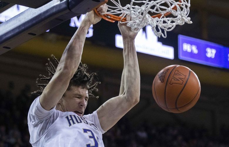 Washington Huskies center Braxton Meah (34) makes a dunk during the first half of game between the UW Huskies and USC Trojans at Alaska Airlines Arena on Friday, Dec. 30, 2022.