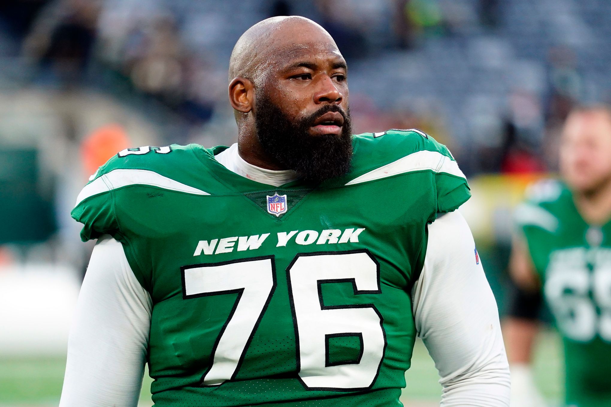 New York Jets offensive tackle George Fant (76) lines up for a play during  an NFL football game against the Cleveland Browns, Sunday, Sept. 18, 2022,  in Cleveland. (AP Photo/Kirk Irwin Stock