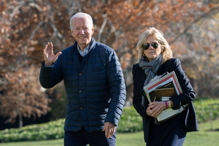 President Joe Biden and first lady Jill Biden walk on the South Lawn of the White House in Washington, upon arrival from spending the weekend at Camp David, Sunday, Dec. 4, 2022.
