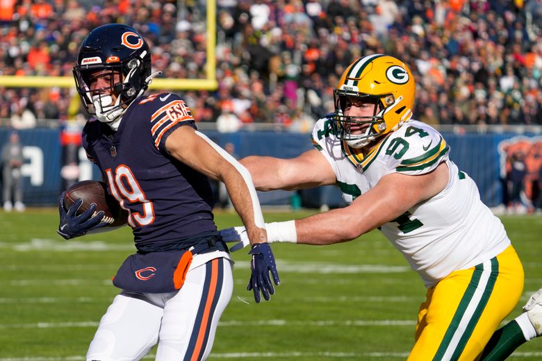 Green Bay Packers wide receiver Equanimeous St. Brown, left, tries