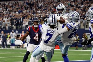 Andre Cisco of the Jacksonville Jaguars tackles Dak Prescott of