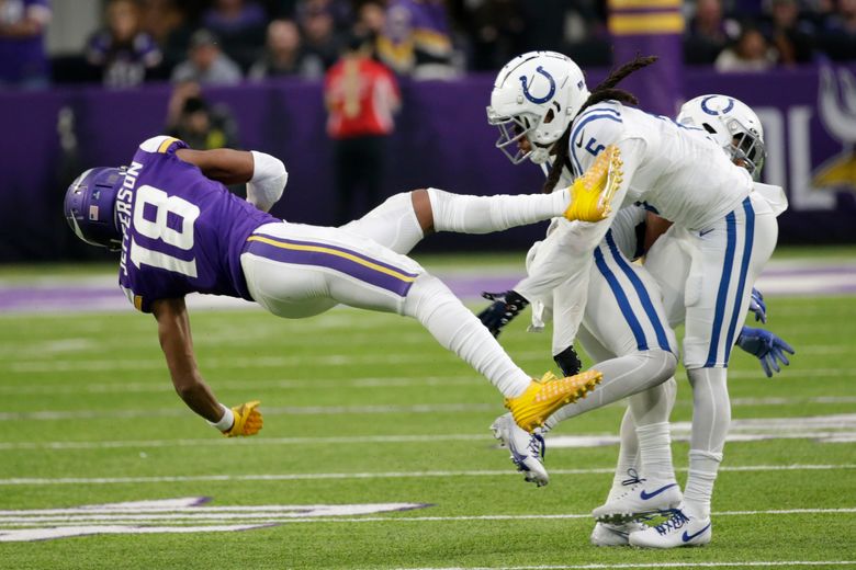 Justin Jefferson of the Minnesota Vikings runs with the ball after a