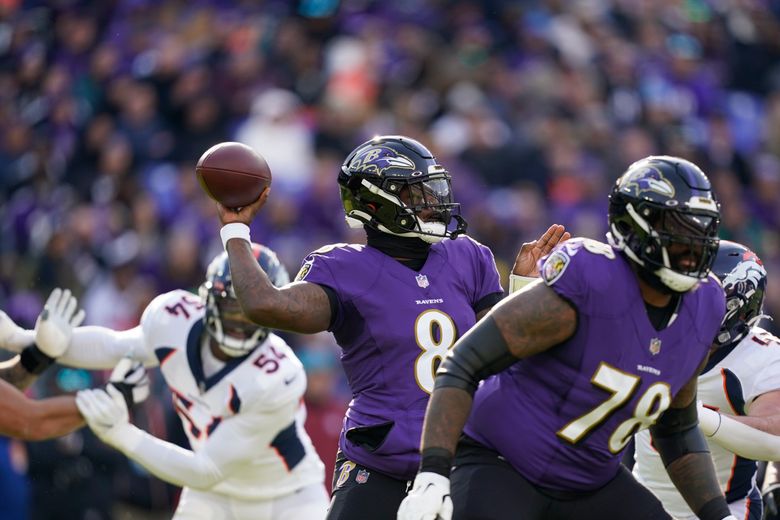 Baltimore Ravens quarterback Lamar Jackson (8) runs out of the tunnel and  waves a towel during player introductions before a NFL football game  against the Miami Dolphins, Sunday, Sept. 18, 2022, in