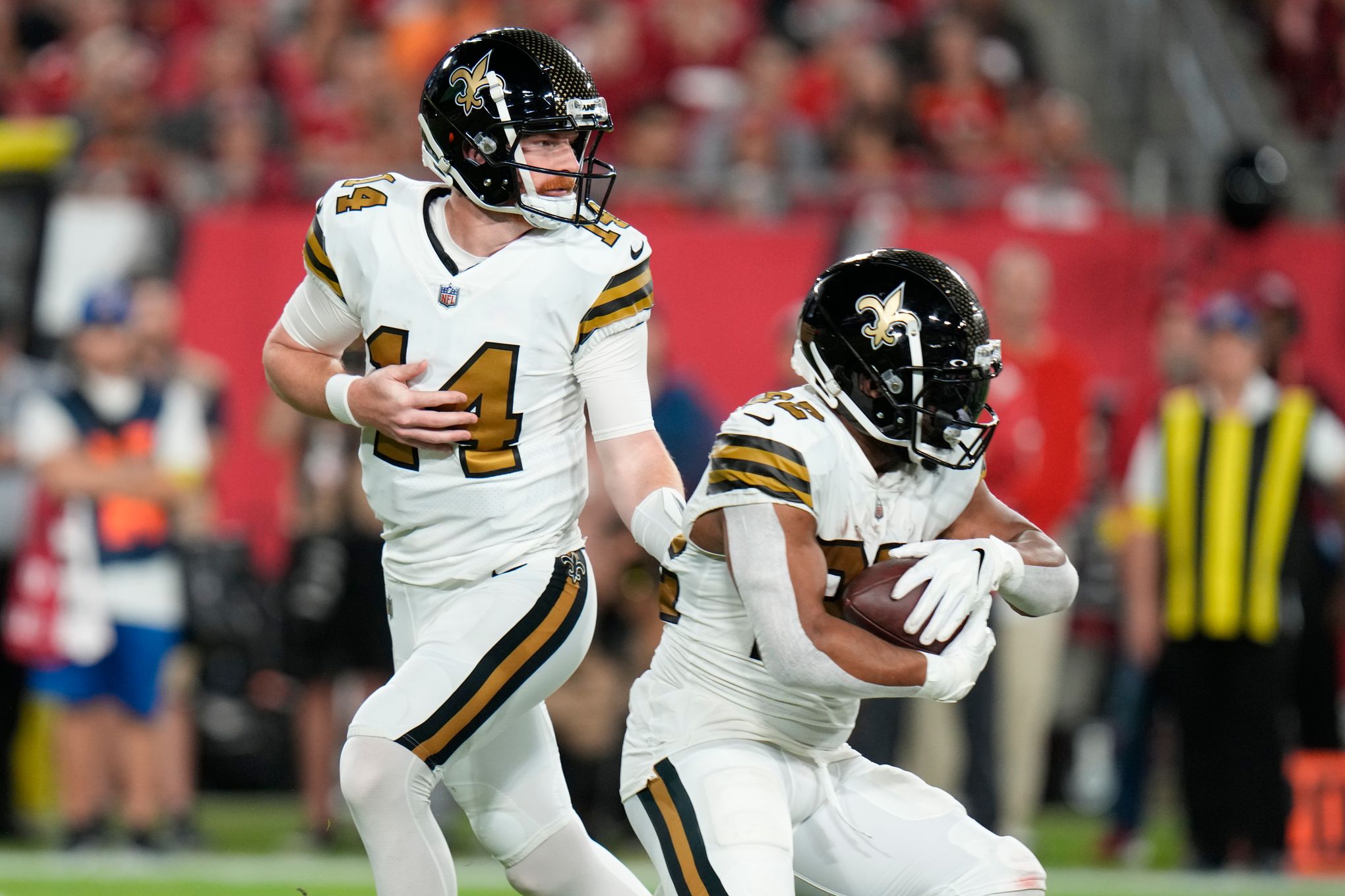 New Orleans Saints quarterback Jameis Winston (2) hands off to