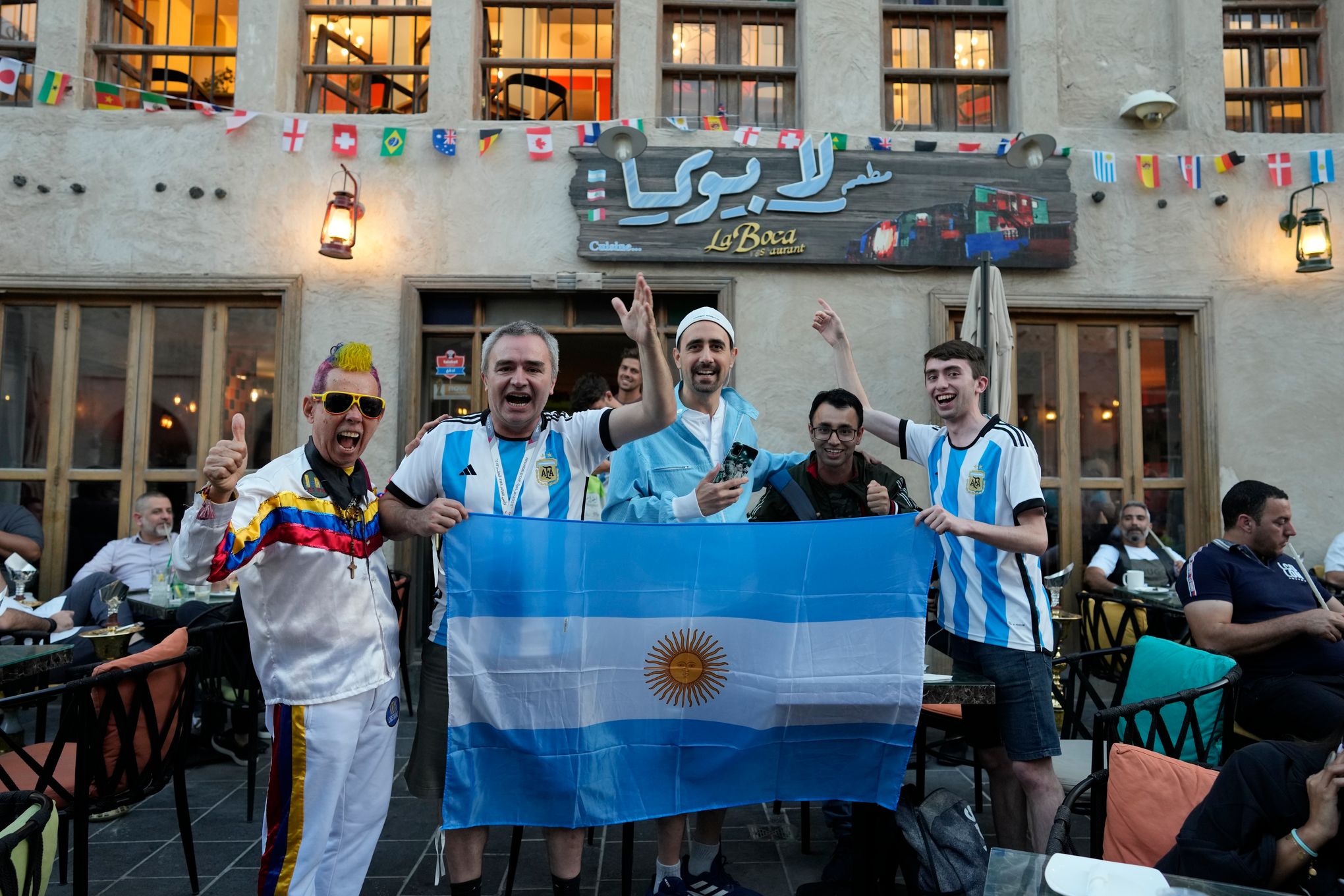 Fans at World Cup pay homage to Maradona with shirts and chants