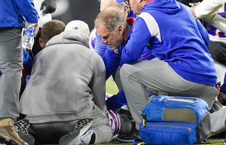 Buffalo Bills’ Damar Hamlin is examined during the first half of an NFL football game against the Cincinnati Bengals, Monday, Jan. 2, 2023, in Cincinnati. The game has been postponed after Buffalo Bills’ Damar Hamlin collapsed, NFL Commissioner Roger Goodell announced. (AP Photo/Joshua A. Bickel) OHMS206