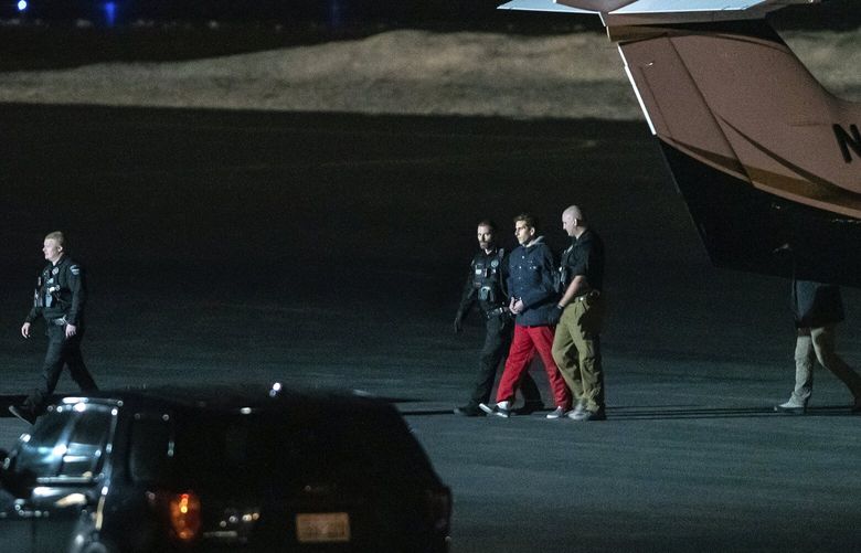 Bryan Kohberger is escorted by law enforcement after arriving at Pullman-Moscow Regional Airport on Thursday, Jan. 4, 2023, in Pullman, Wash. Kohberger was extradited from Pennsylvania earlier Thursday, for the alleged murder of four University of Idaho students on Nov. 13, 2022. (Austin Johnson/Lewiston Tribune via AP) IDLEW201 IDLEW201