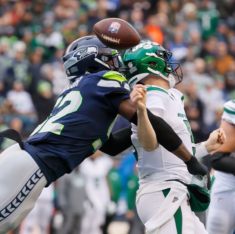 Seahawks LB Darrell Taylor runs onto the field after an