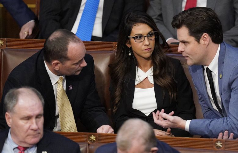 Republicans Bob Good (Va.), Lauren Boebert (Colo.) and Matt Gaetz (Fla.) talk on Wednesday at the Capitol. MUST CREDIT: Washington Post photo by Jabin Botsford.