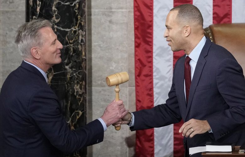 Incoming House Speaker Kevin McCarthy of Calif., receives the gavel from House Minority Leader Hakeem Jeffries of N.Y., on the House floor at the U.S. Capitol in Washington, early Saturday, Jan. 7, 2023. (AP Photo/Andrew Harnik) DCAH428 DCAH428
