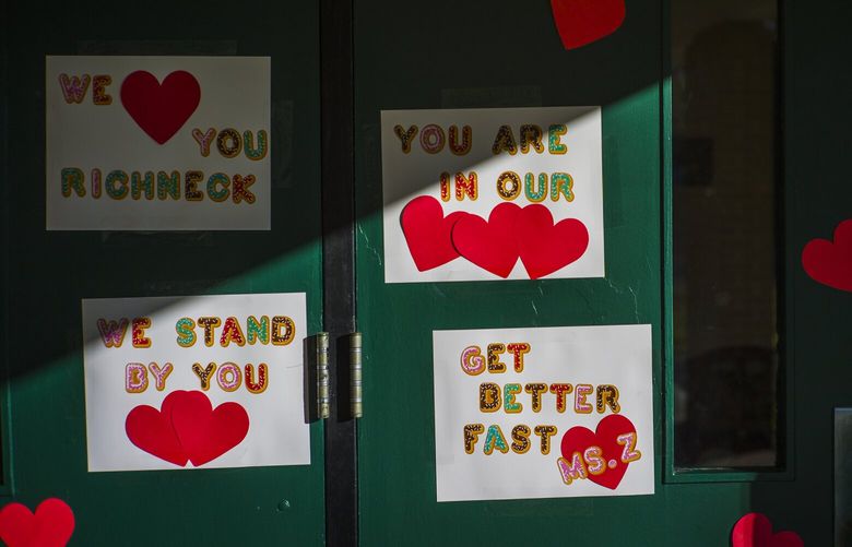 Messages of support for teacher Abby Zwerner, who was shot by a 6 year old student, grace the front door of Richneck Elementary School Newport News, Va. on Monday Jan. 9, 2023. The Virginia teacher who authorities say was shot by a 6-year-old student is known as a hard-working educator who’s devoted to her students and enthusiastic about the profession that runs in her family. (AP Photo/John C. Clark) JCVA215 JCVA215