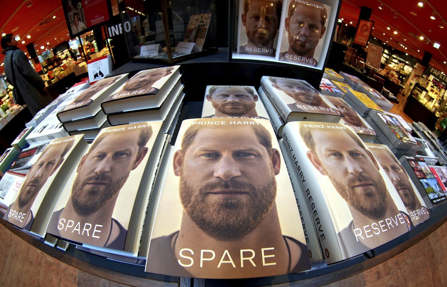 CORRECTS SLUG — Copies of the new book by Prince Harry called “Spare” are displayed at a book store in Berlin, Germany, Tuesday, Jan. 10, 2023. Prince Harry’s memoir “Spare” went on sale in bookstores on Tuesday, providing a varied portrait of the Duke of Sussex and the royal family. (AP Photo/Michael Sohn) SOB101 SOB101