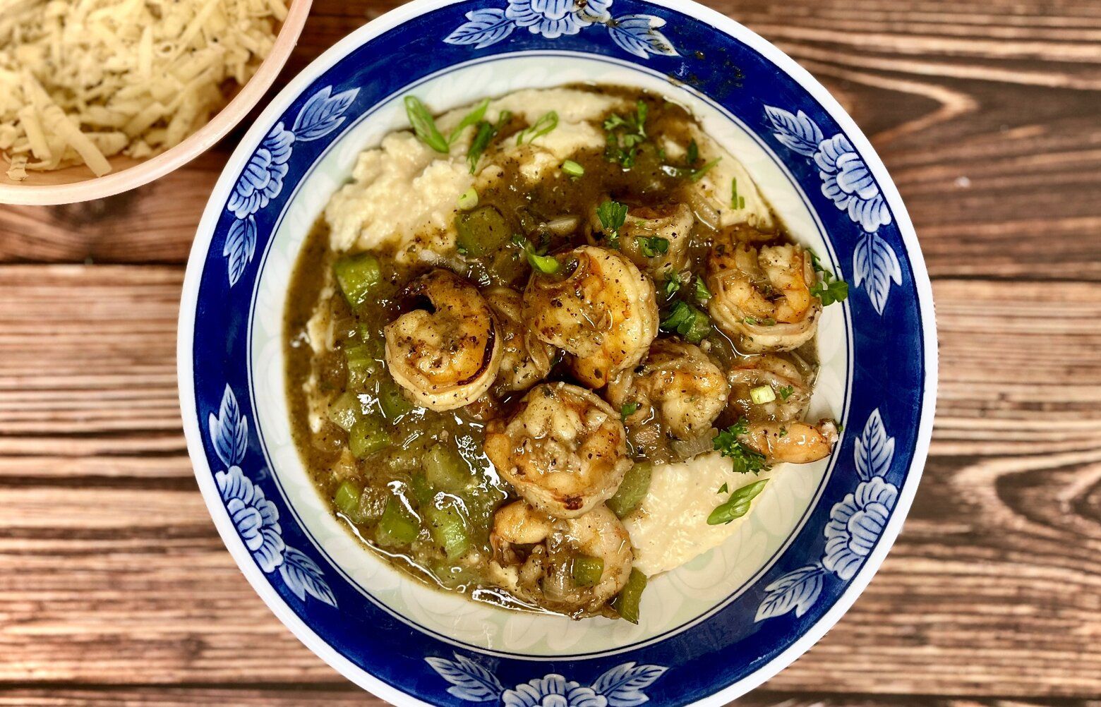 You have the option between grits and polenta when making this shrimp and grits recipe.