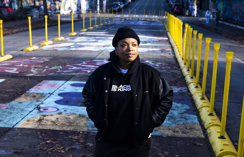 Local artist Takiyah Ward is photographed on Capitol Hill on Tuesday, Jan, 3, 2022. Ward contributed to the “TT” letters in the Black Lives Matter mural in Capitol Hill.