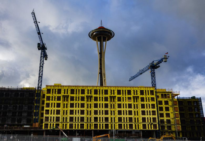 New apartments under construction are set to open this summer, near the Space Needle, on Dec. 18. (Ken Lambert / The Seattle Times)