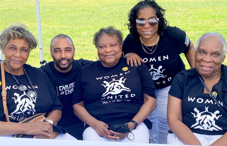 Members of Women United Seattle gather for a day of service last year with former Seahawk Doug Baldwin, a Champions of Change co-founder: From left, Wendy Fortney, Baldwin, Sadie Pimpleton, Alesia Cannady and Gloria Johnson. Cannady is founder and president of Women United Seattle.