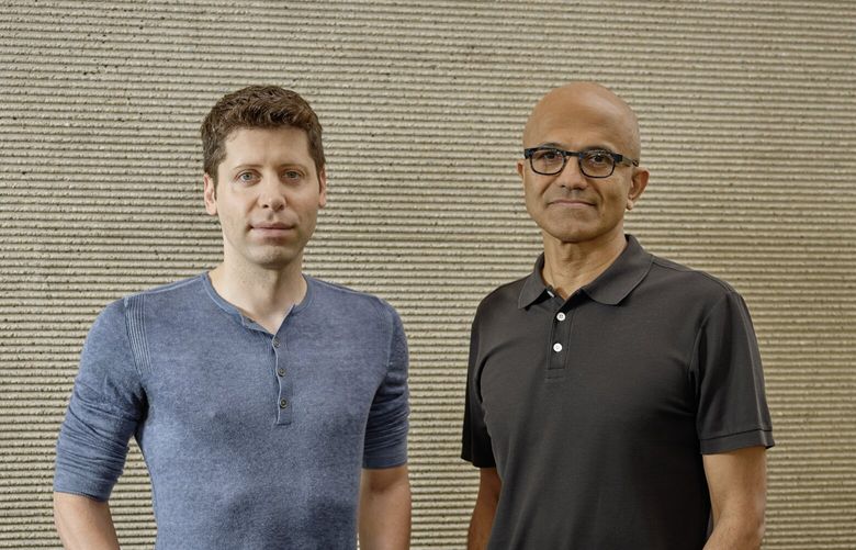FILE — Sam Altman, left, one of the founders of OpenAI, and Satya Nadella, Microsoft’s chief executive, at the Microsoft Campus in Redmond, Wash. on July 15, 2019. As the new chatbot wows the world with its conversational talents, the tech giant is poised to reap the benefits. (Ian C. Bates / The New York Times) 