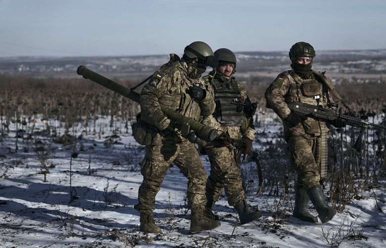FILE – Ukrainian soldiers on their positions in the frontline near Soledar, Donetsk region, Ukraine, on Jan. 11, 2023. Russia’s Defense Ministry said Friday Jan. 13, 2023 that its forces have captured the salt-mining town of Soledar. (AP Photo/Libkos, File) LGK505 LGK505