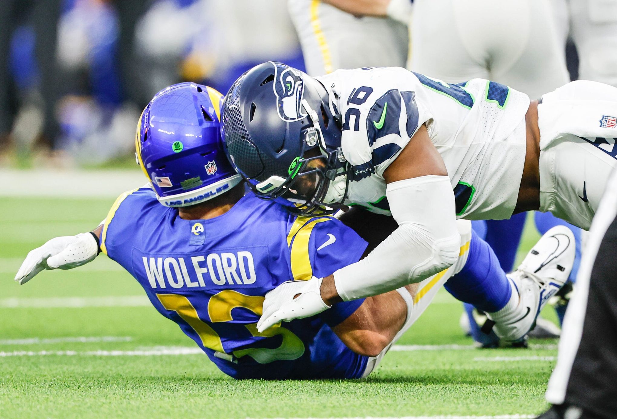 Tariq Woolen knee surgery. Seahawks eye training camp return