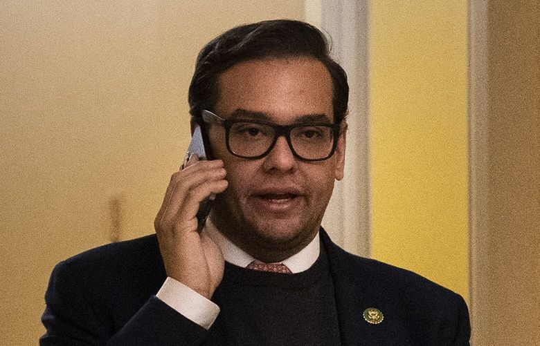 Rep. George Santos (R-N.Y.) walks out of a vote on Capitol Hill, in Washington on Wednesday, Jan. 11, 2023. Republican officials on Long Island, including Rep. Anthony D’Esposito (R-N.Y.), called on Wednesday for Santos to resign, as he faces multiple inquiries into his finances, campaign spending and fabrications on the campaign trail.(Haiyun Jiang/The New York Times) XNYT142 XNYT142
