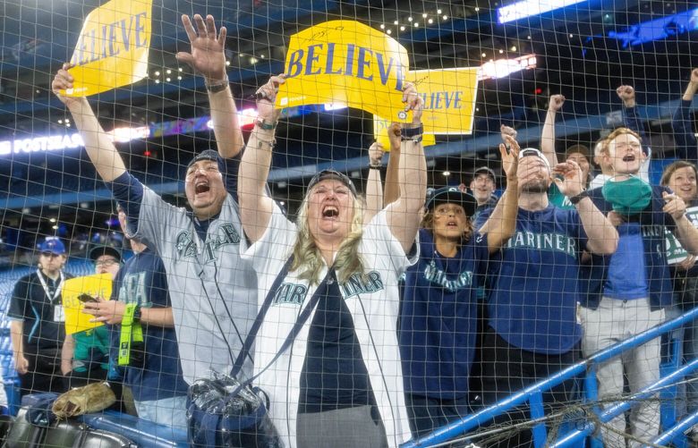 Mariner fans join in the celebration at Rogers Centre. 221789