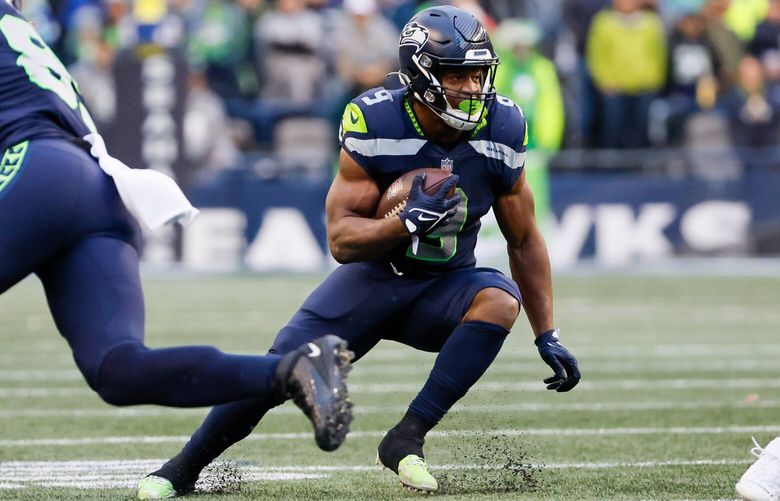 Seattle Seahawks running back Kenneth Walker III rushes the ball during the fourth quarter. 222737